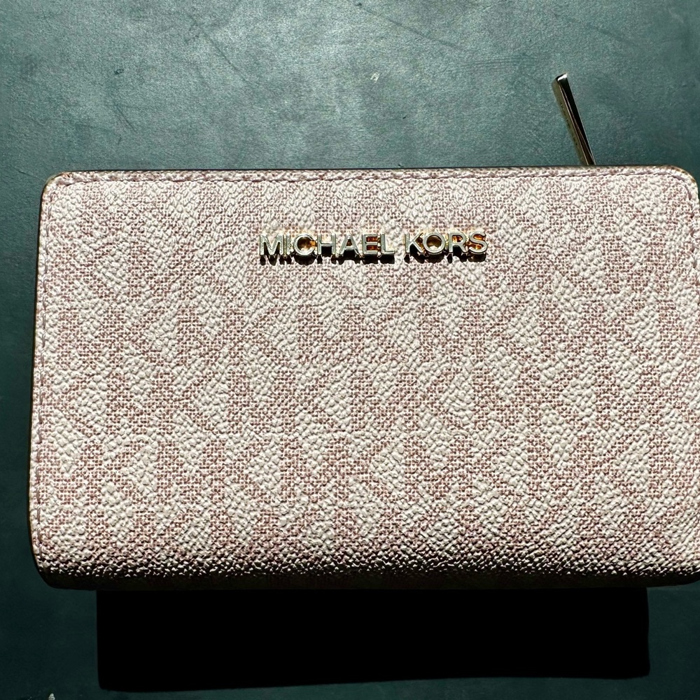 Michael Kors light pink zip-around wallet with gold logo